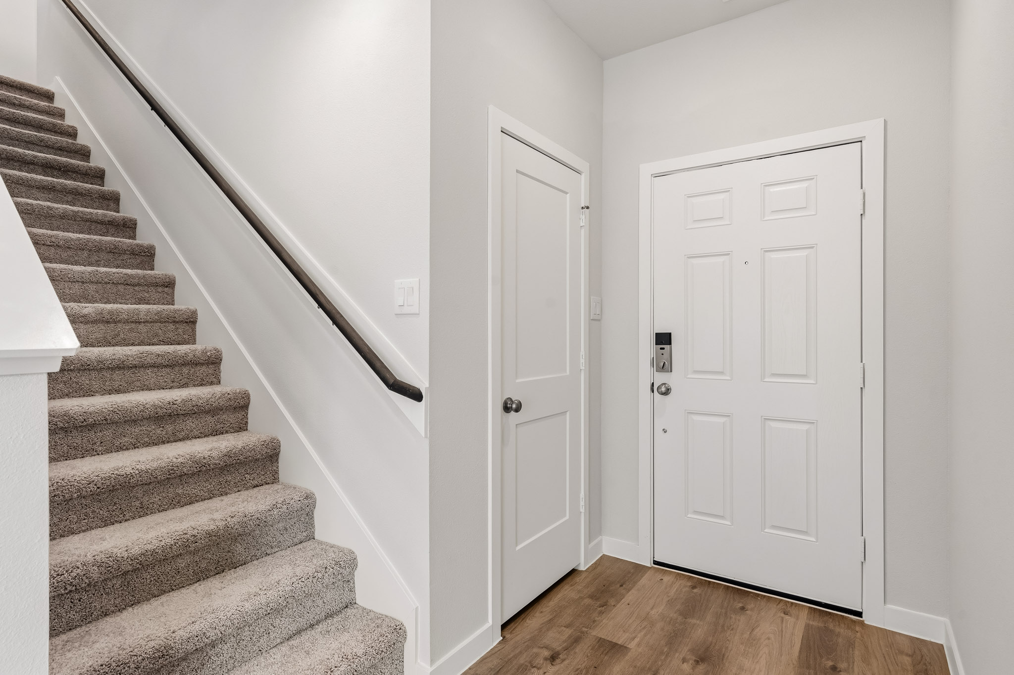 A staircase leading to a door.