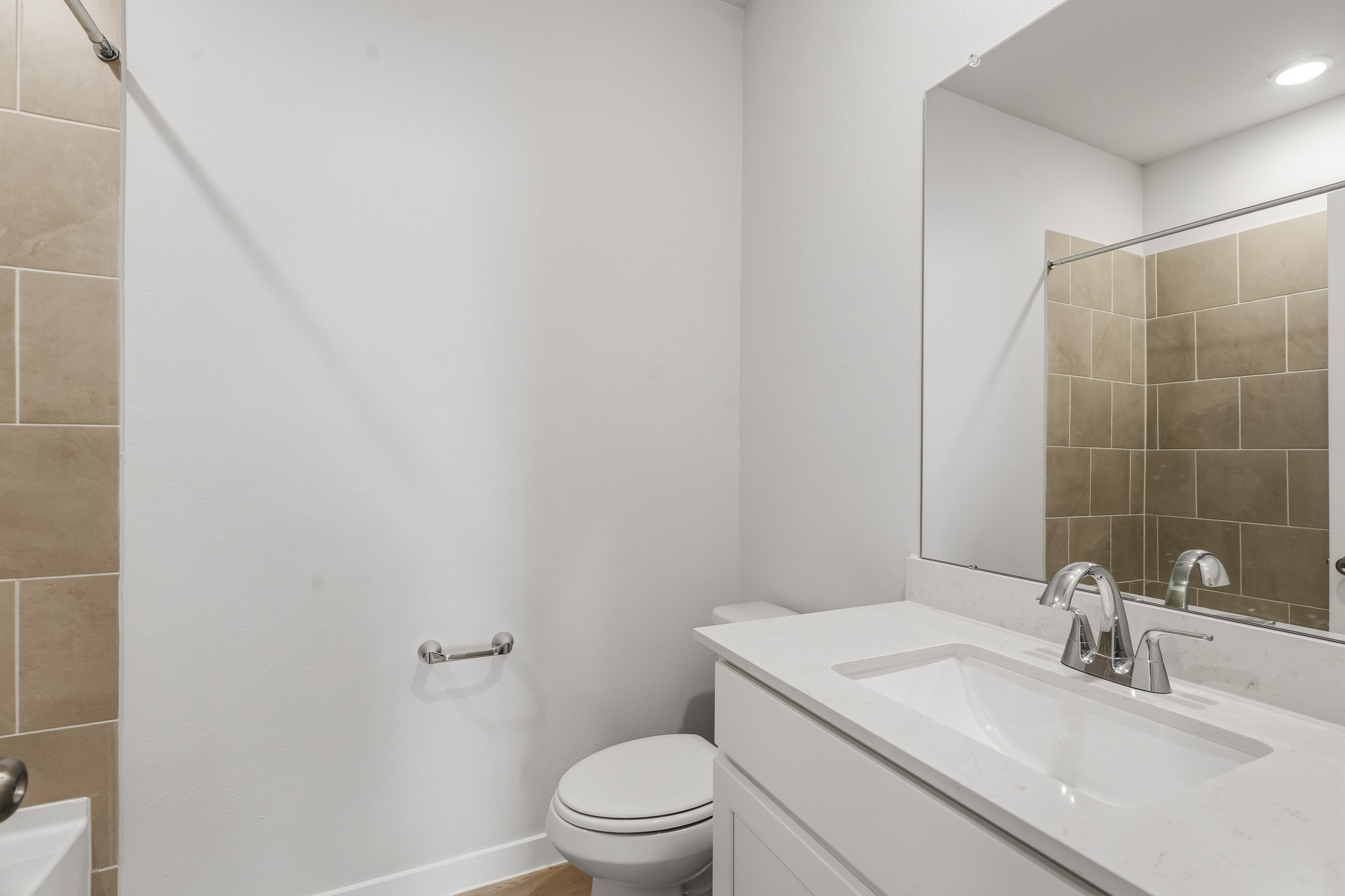 A bathroom with a sink and a toilet.
