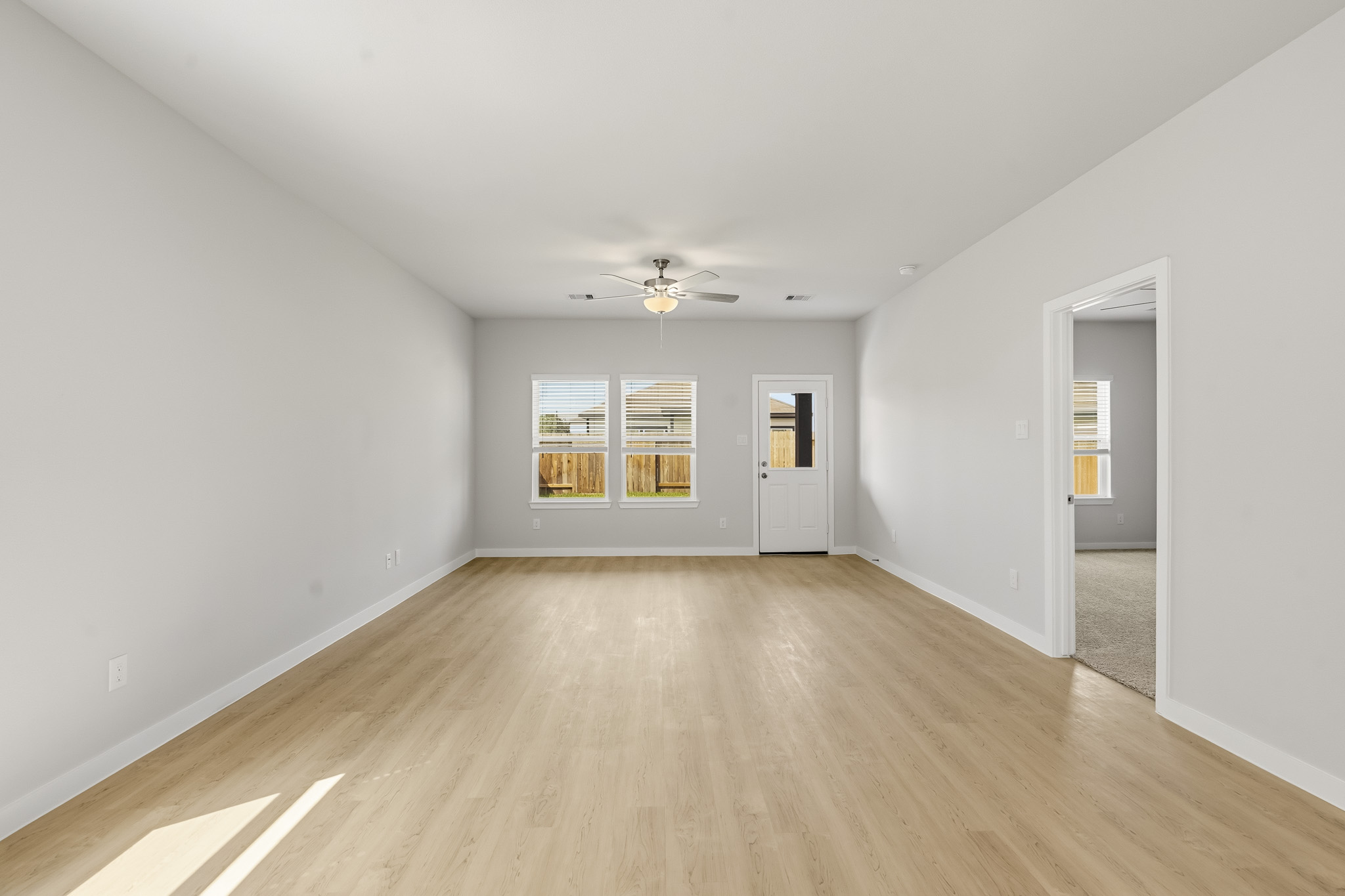 A room with a wood floor and a wood floor with a wood floor.