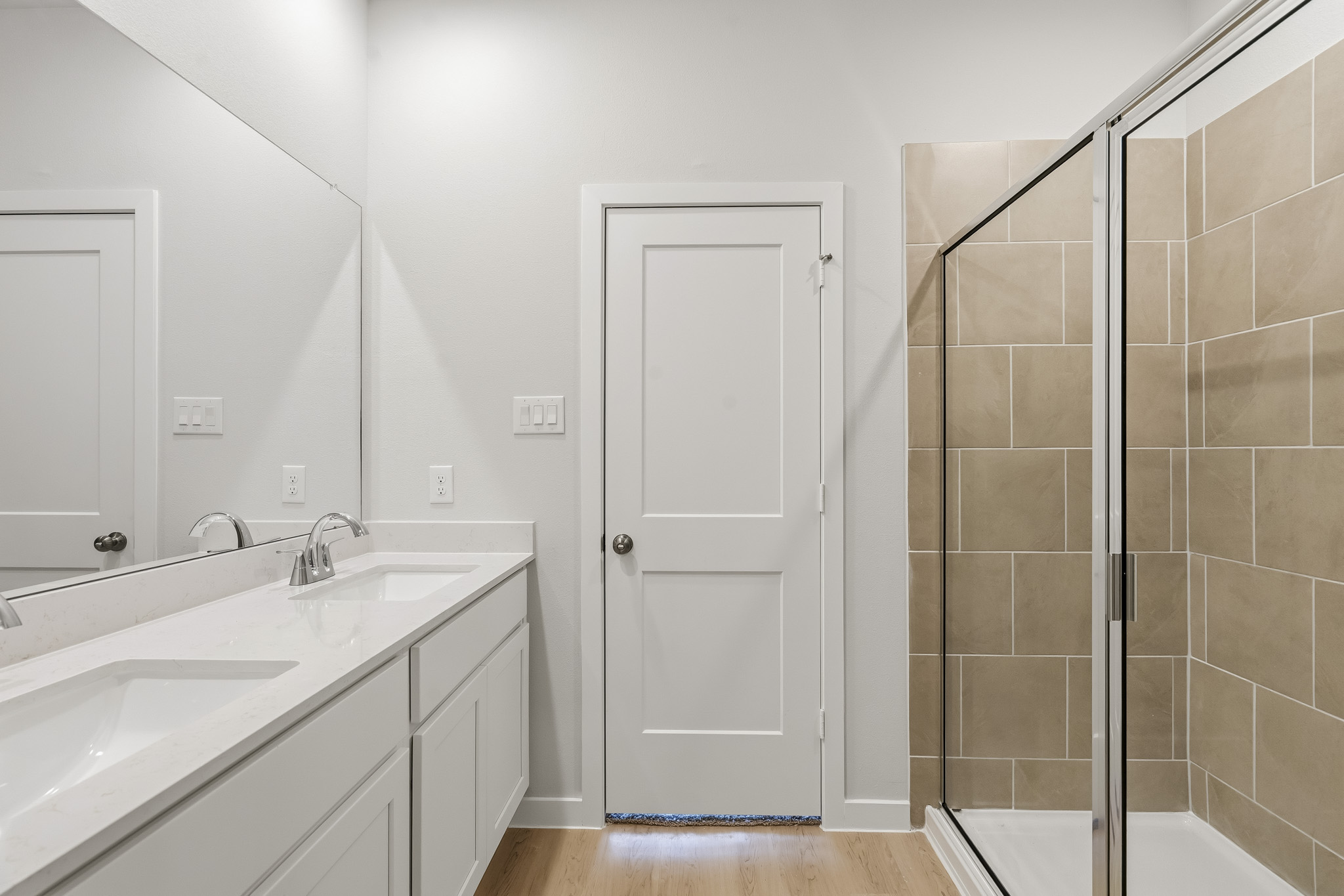 A bathroom with a glass shower.