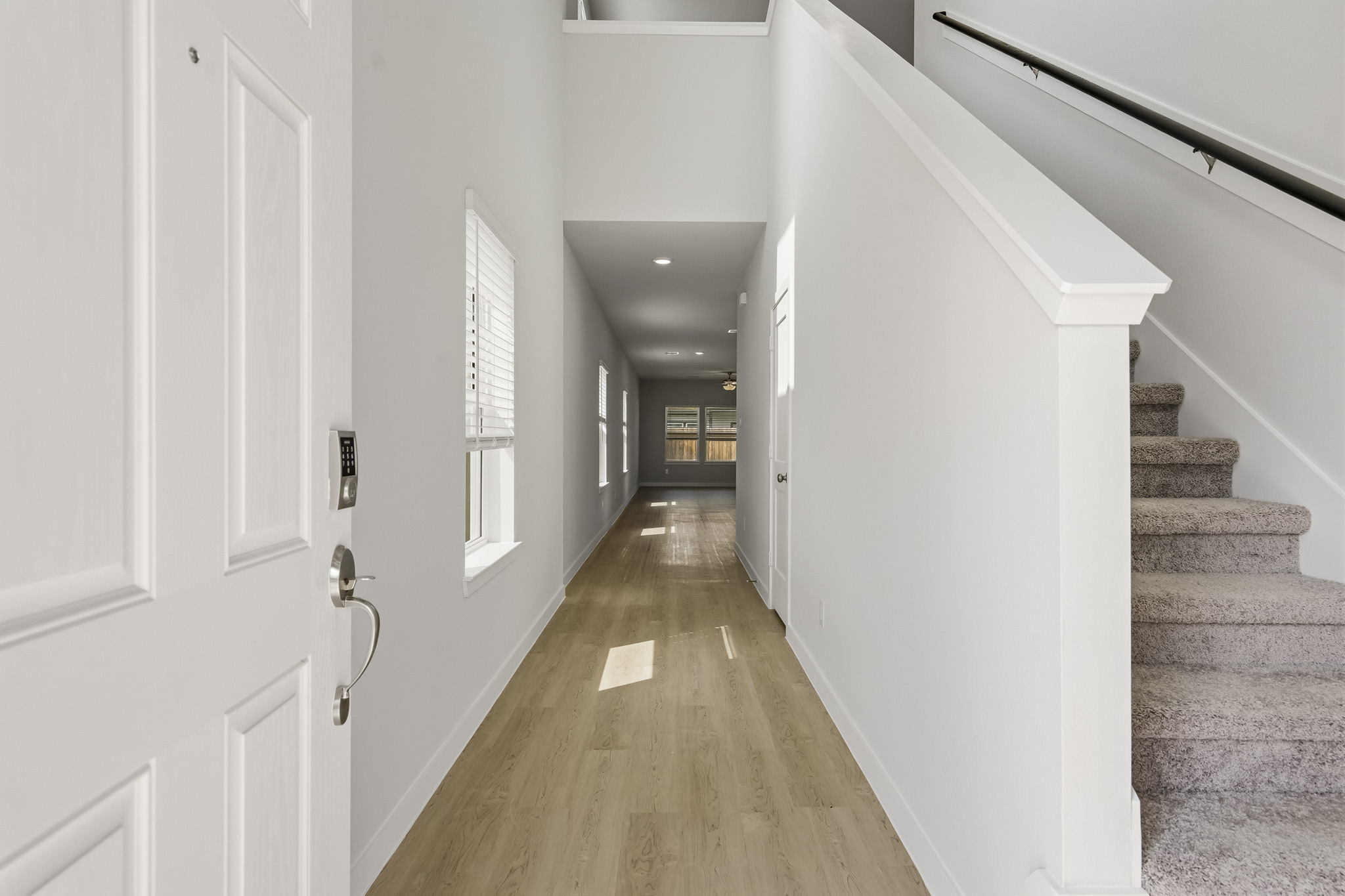 A hallway with white doors.