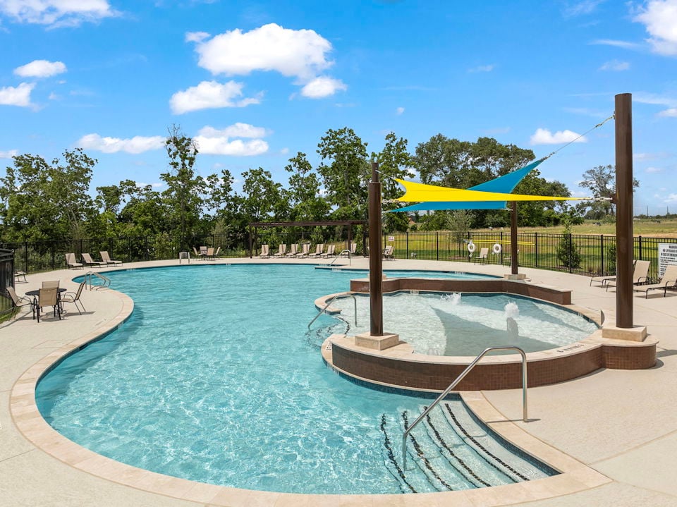 A swimming pool with a slide.