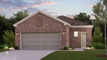 A brick house with a garage.