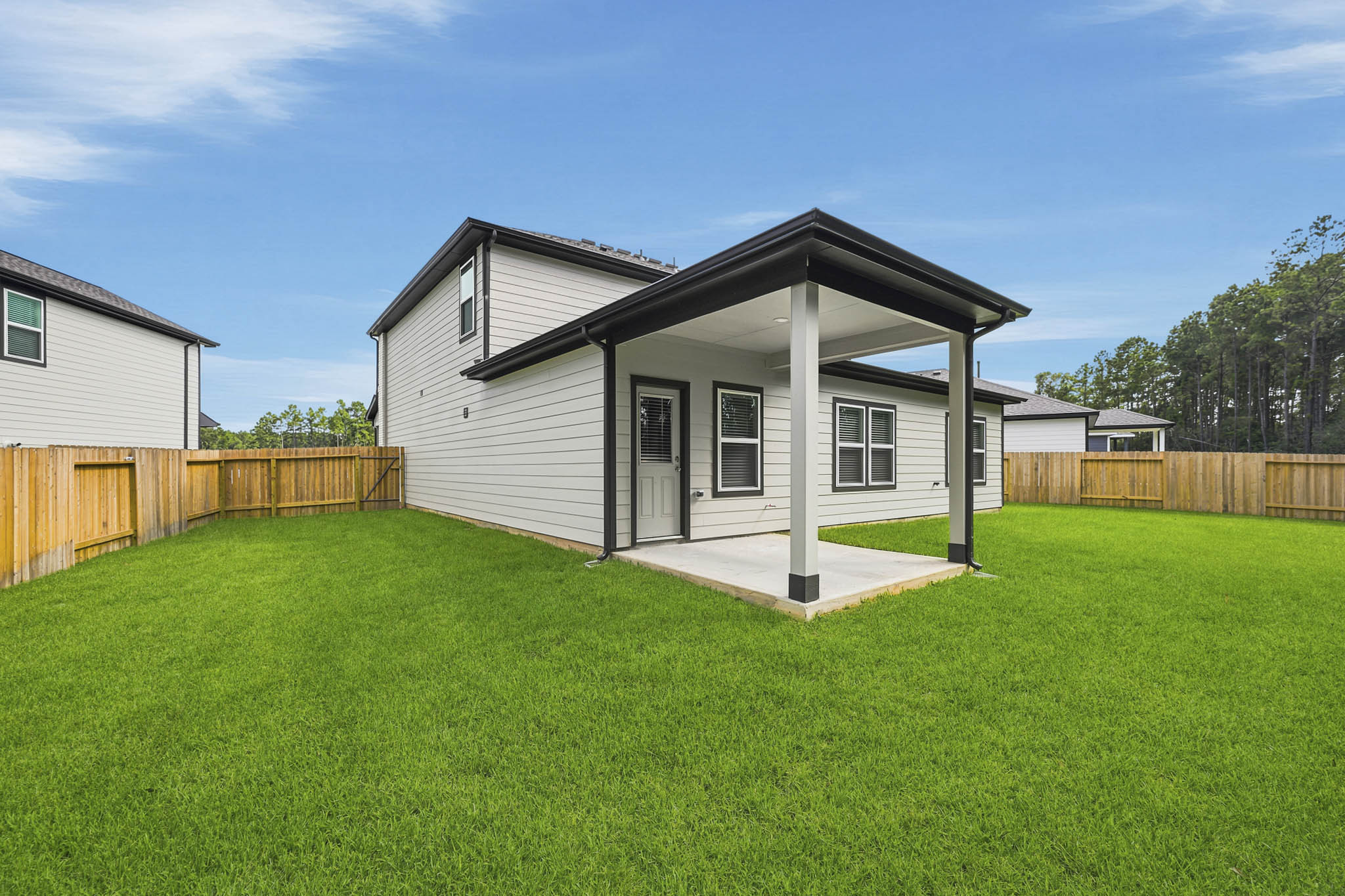 A small house with a fence.