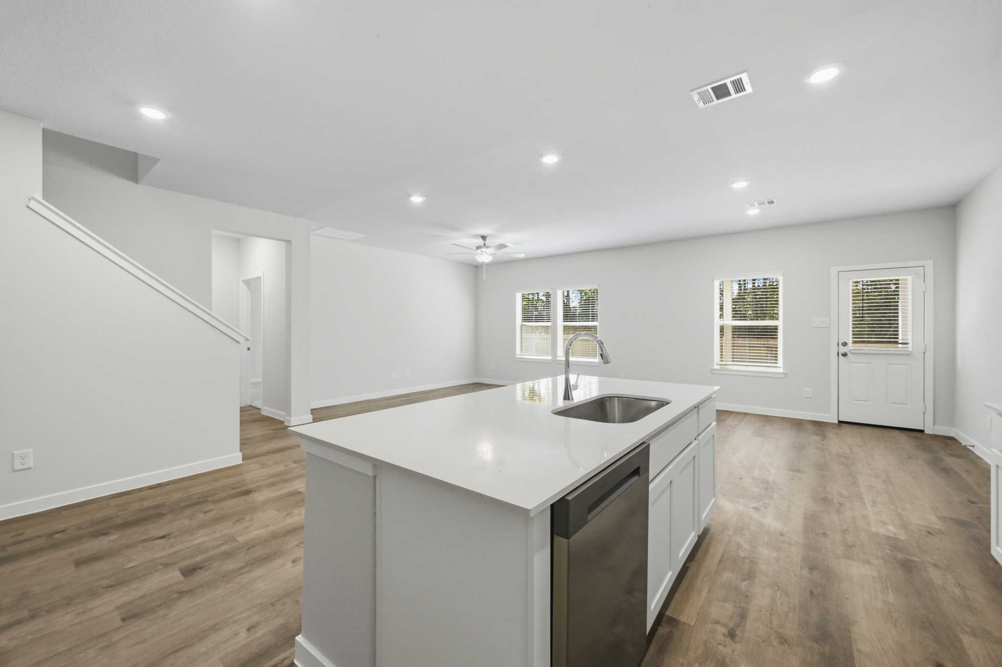 A kitchen with a sink and cabinets.
