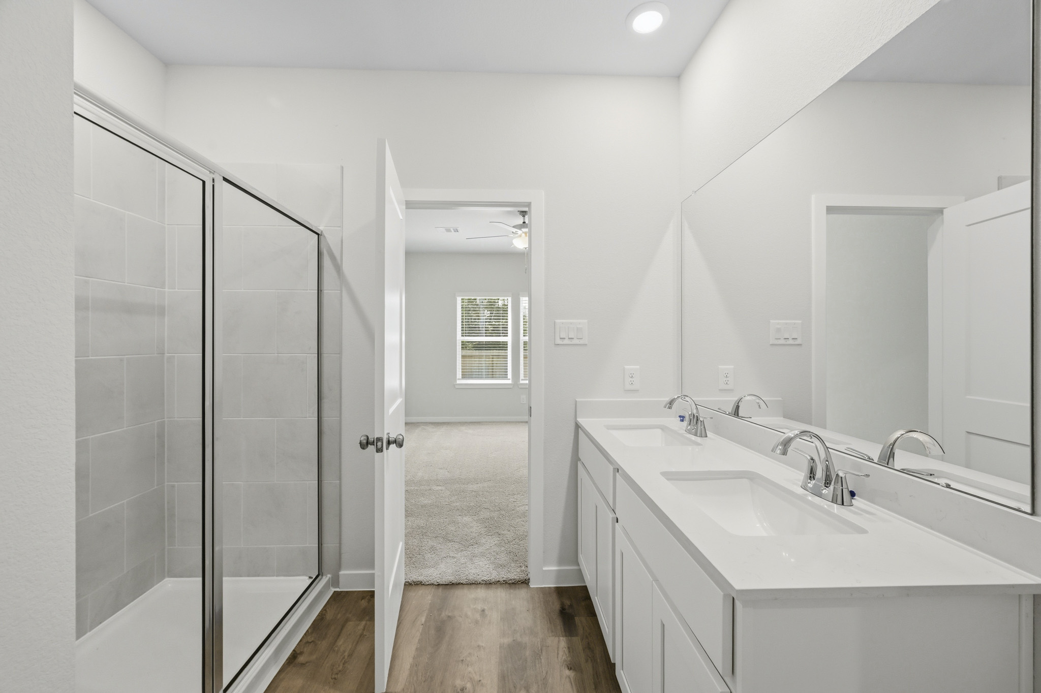 A bathroom with a glass shower.