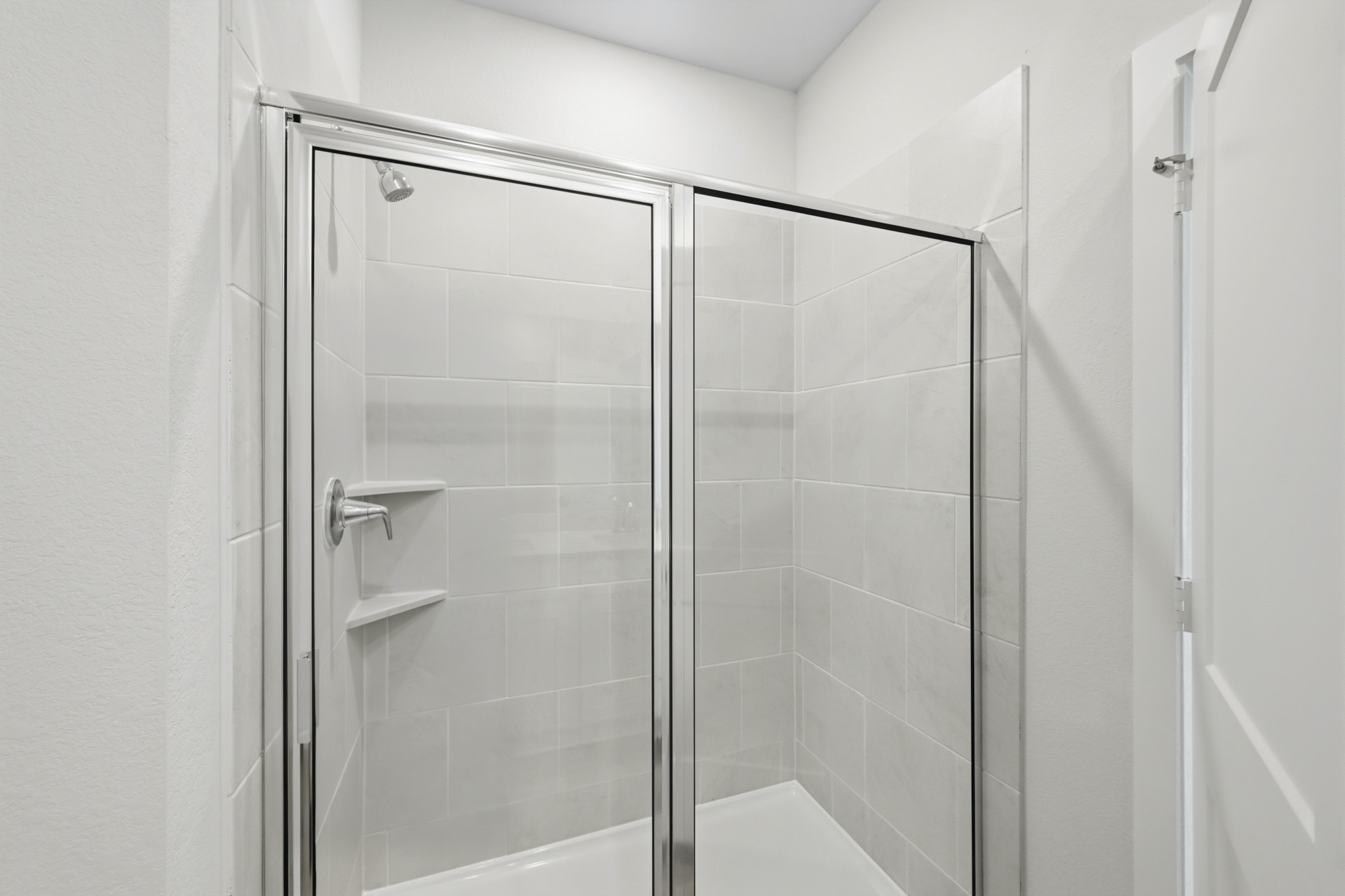 A shower unit in a bathroom.