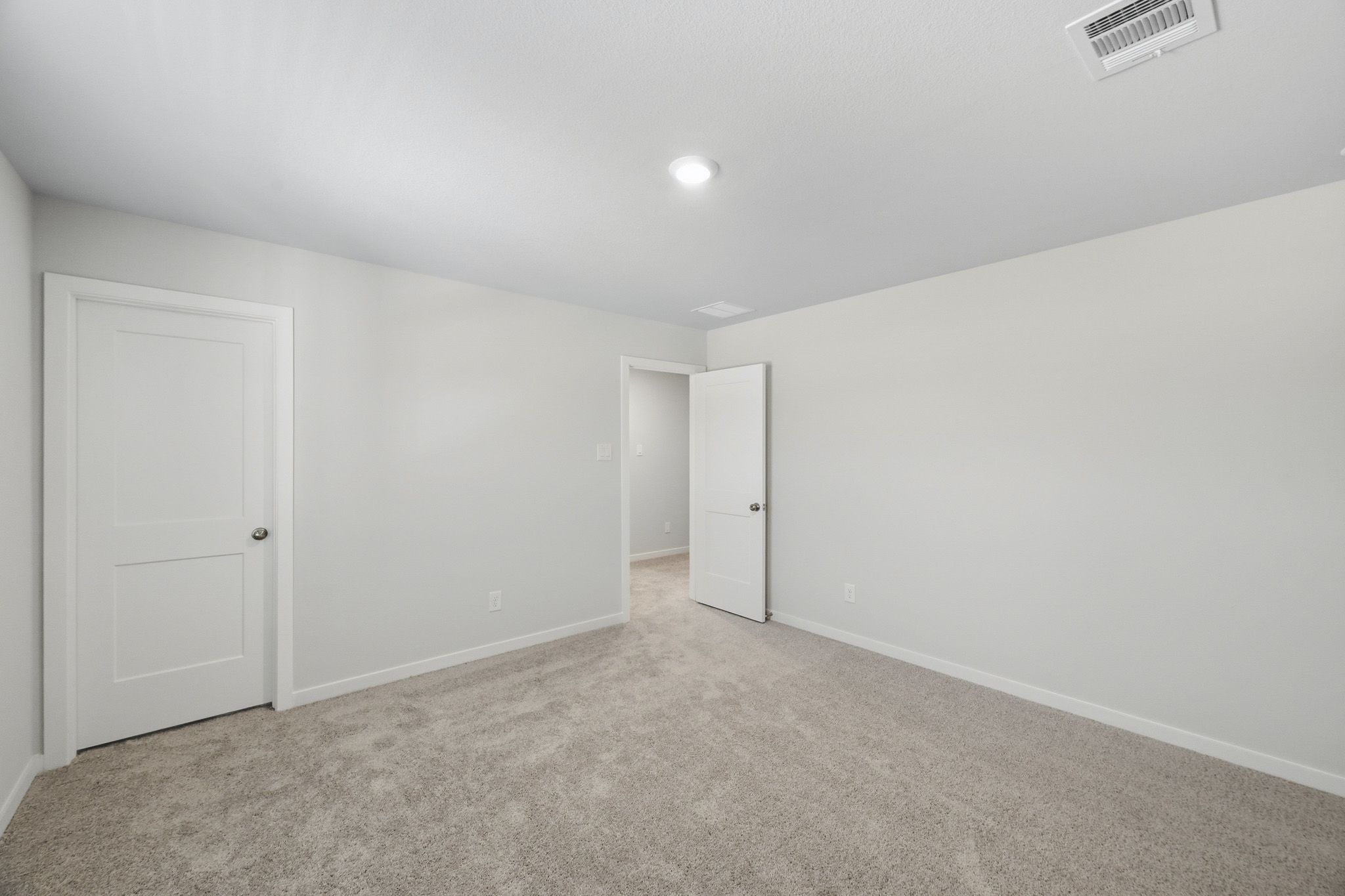 A room with white doors.