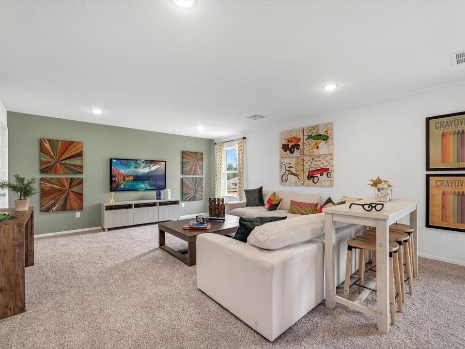 A living room with art on the wall.