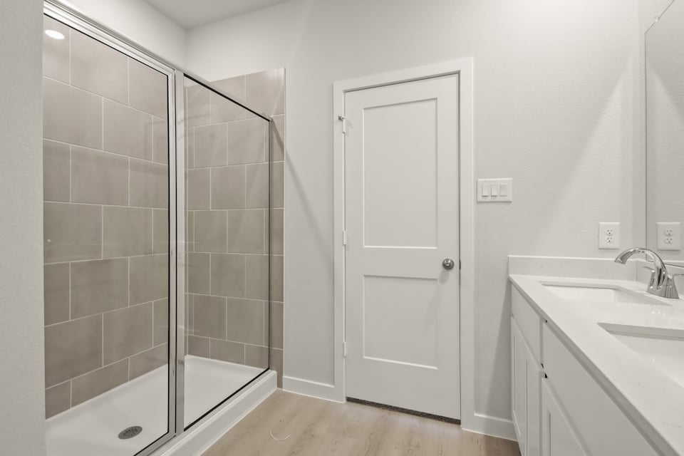 A bathroom with a glass shower.