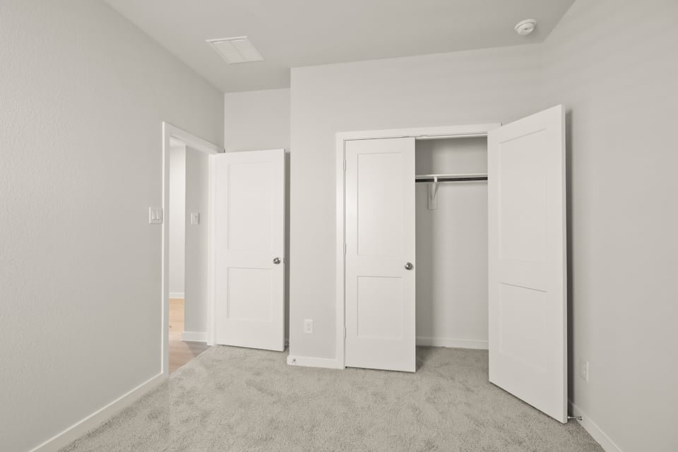 A room with white doors.