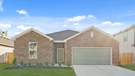 A brick house with a garage.