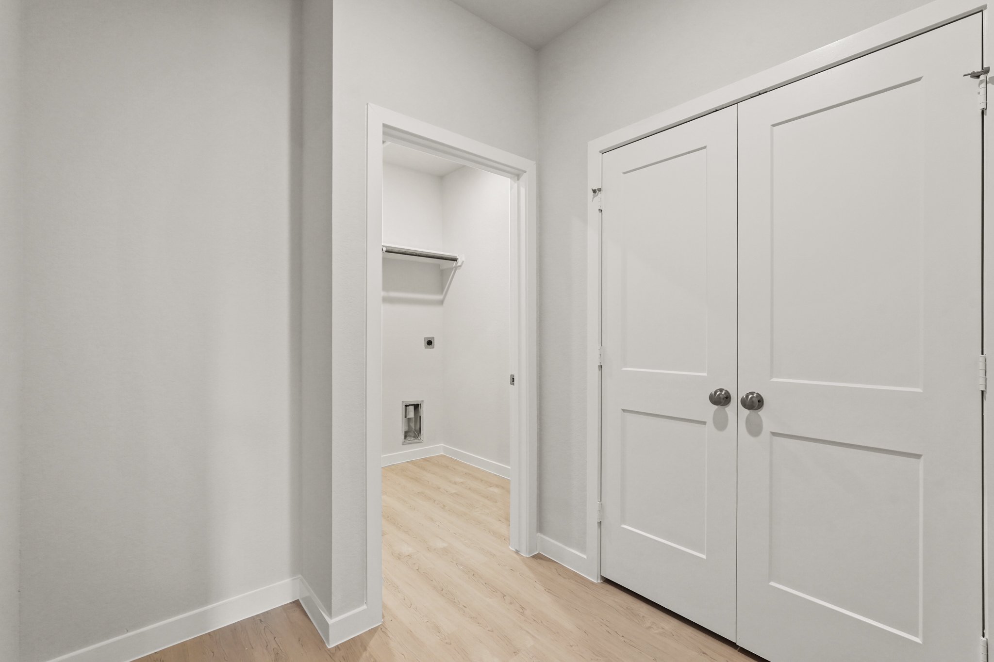 A room with white cabinets.