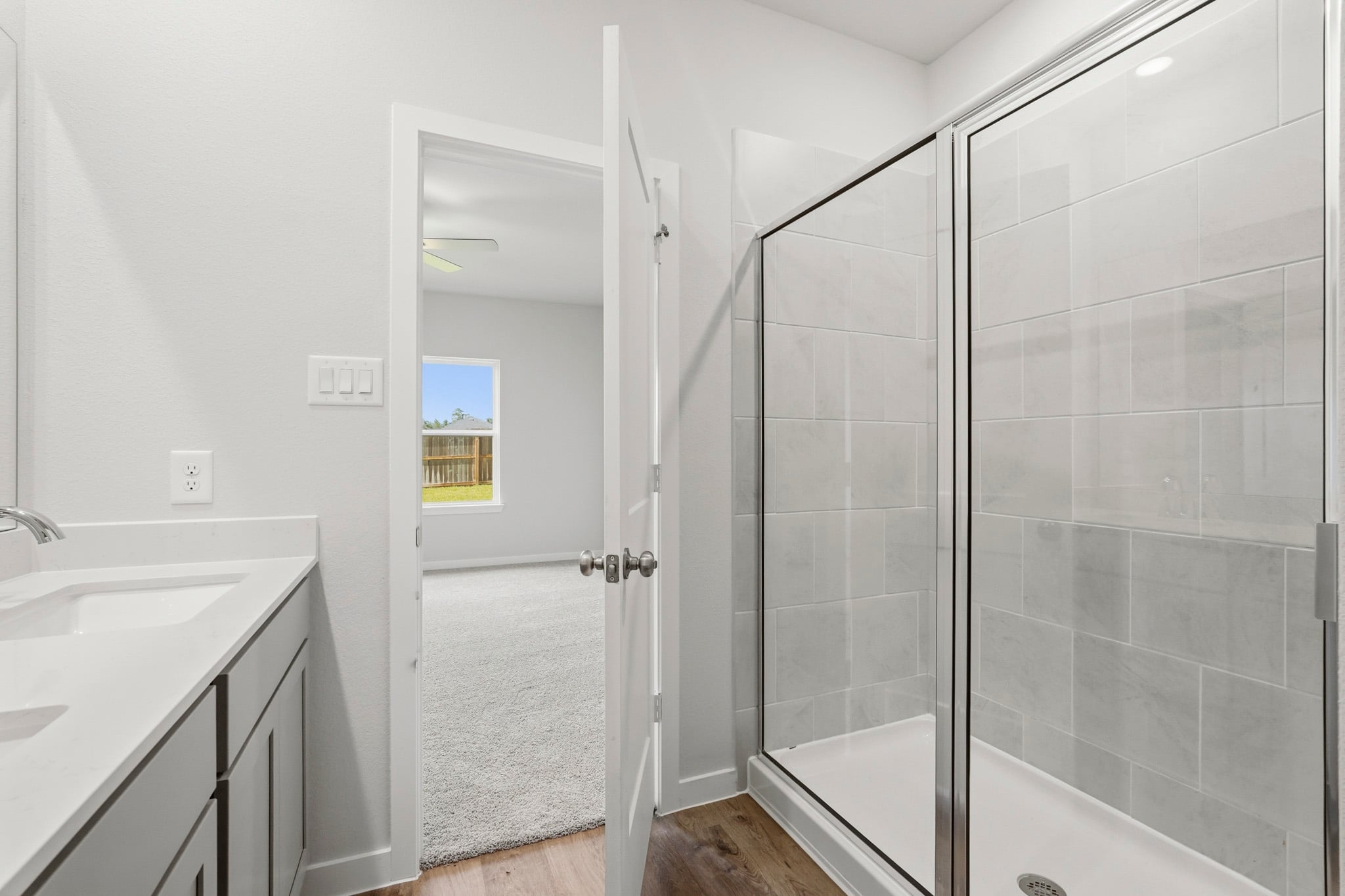 A bathroom with a glass shower.
