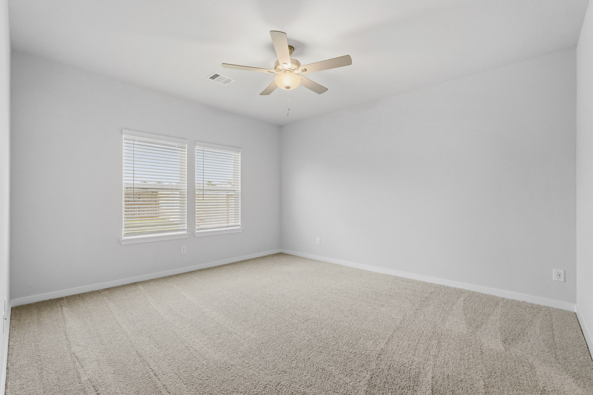 A ceiling fan in a room.