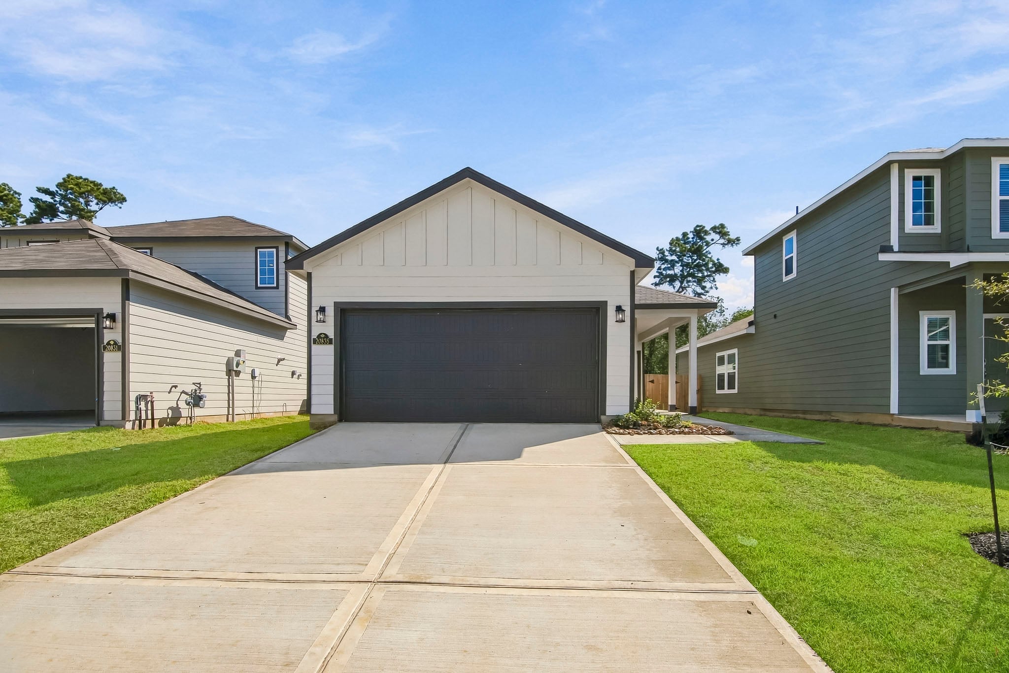 A driveway leading to a house.