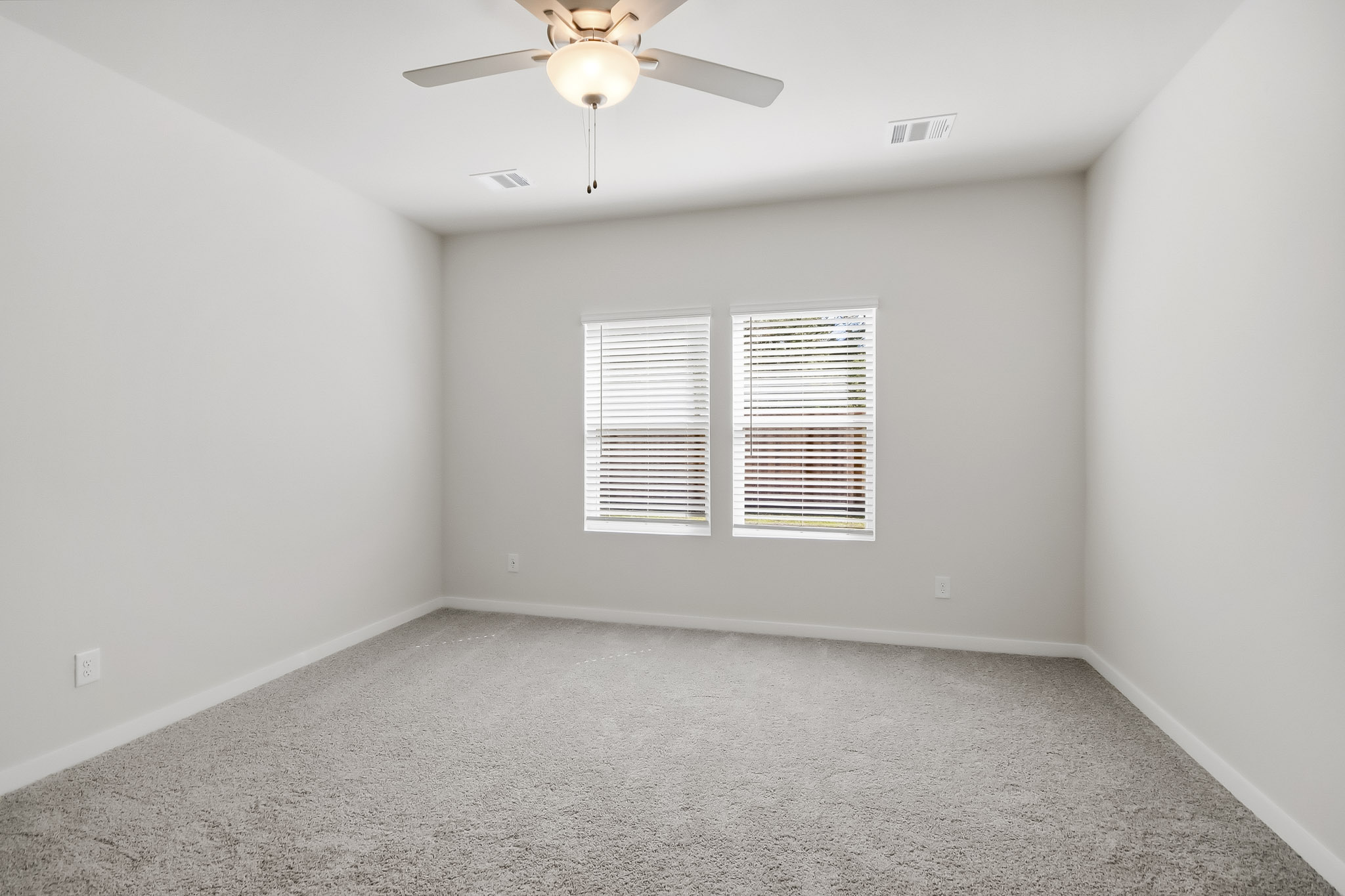 A ceiling fan in a room.