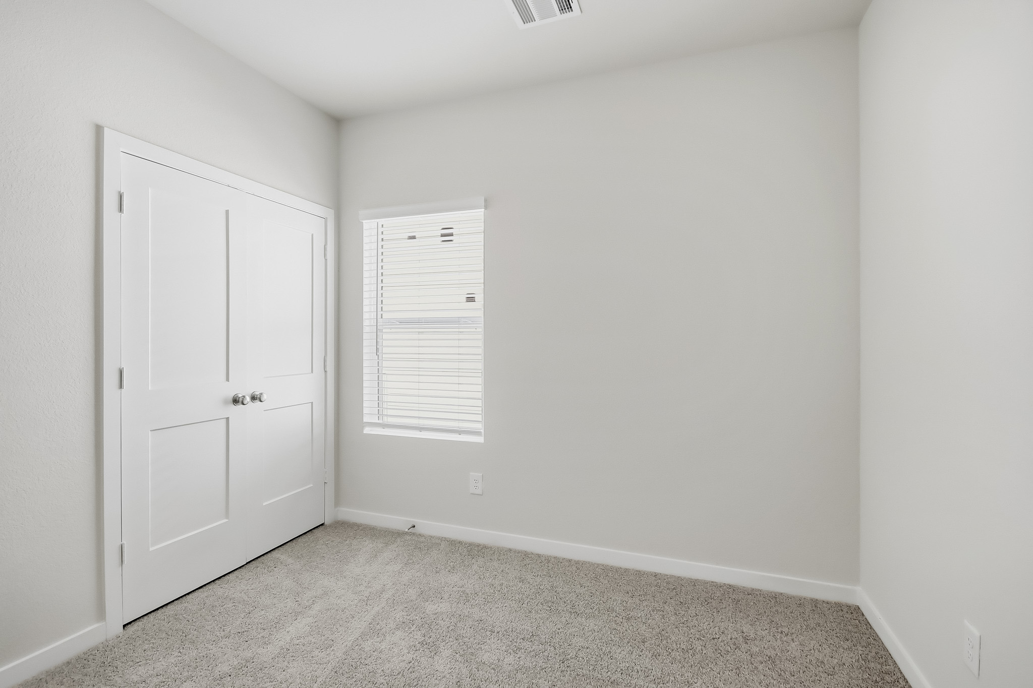 A room with white doors.