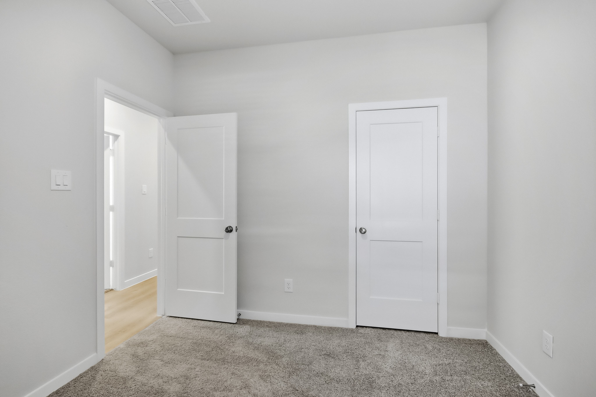 A room with white doors.