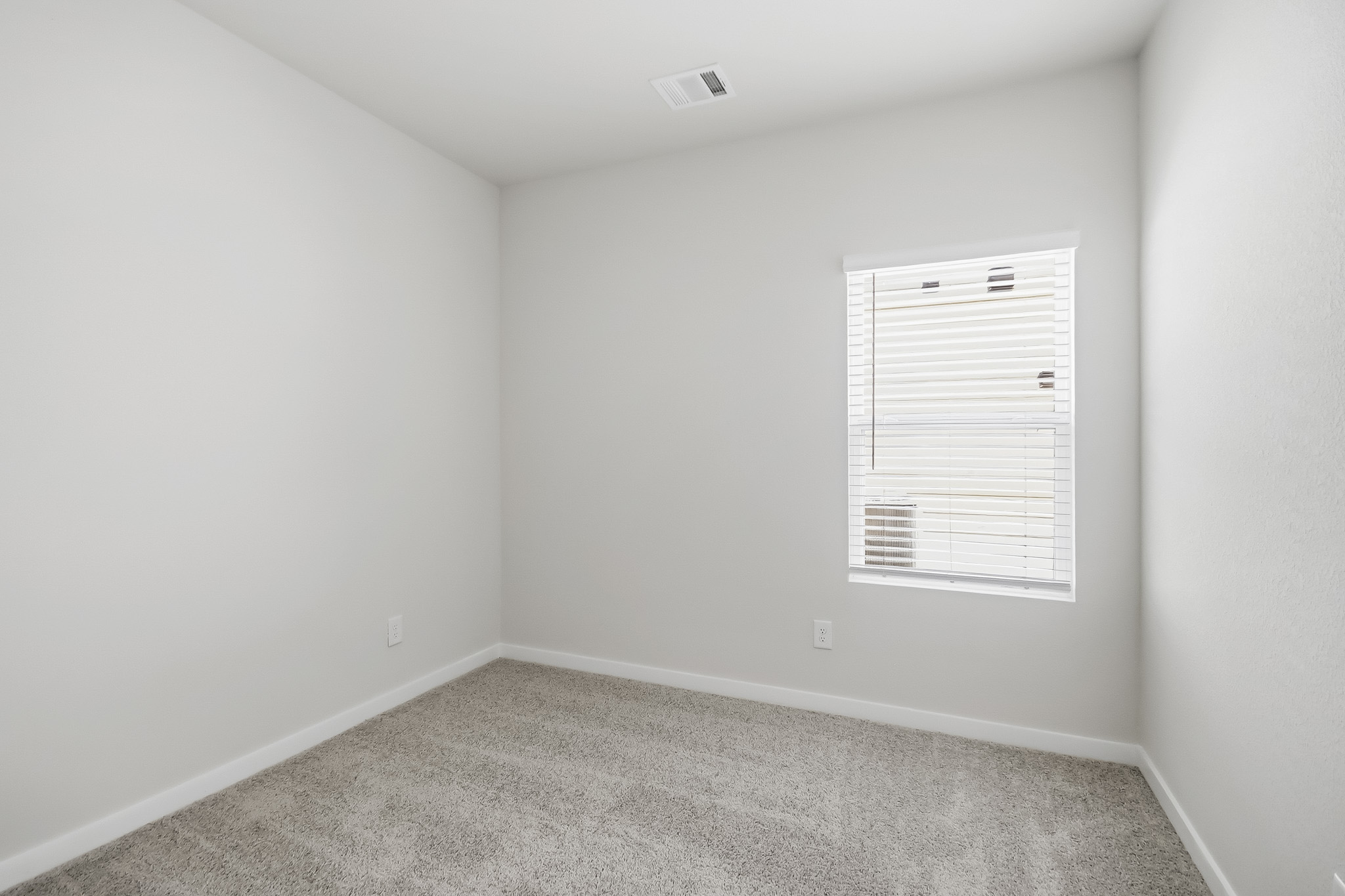 A white wall with a whiteboard.
