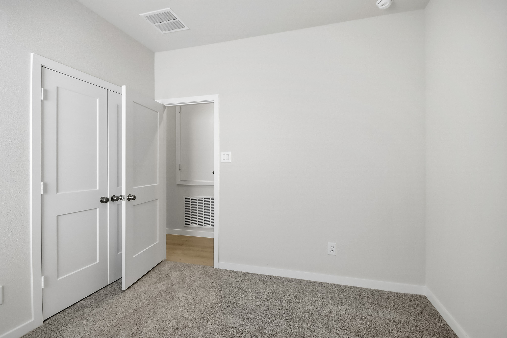 A room with white doors.