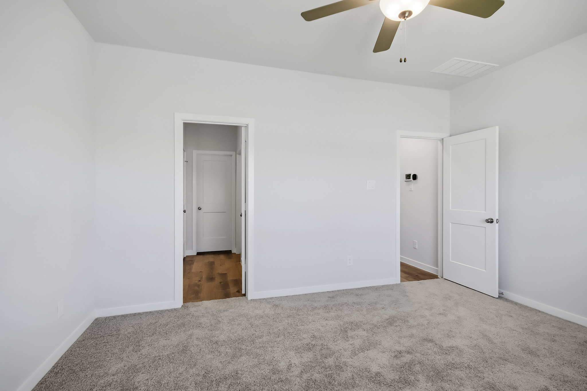 A room with white doors.