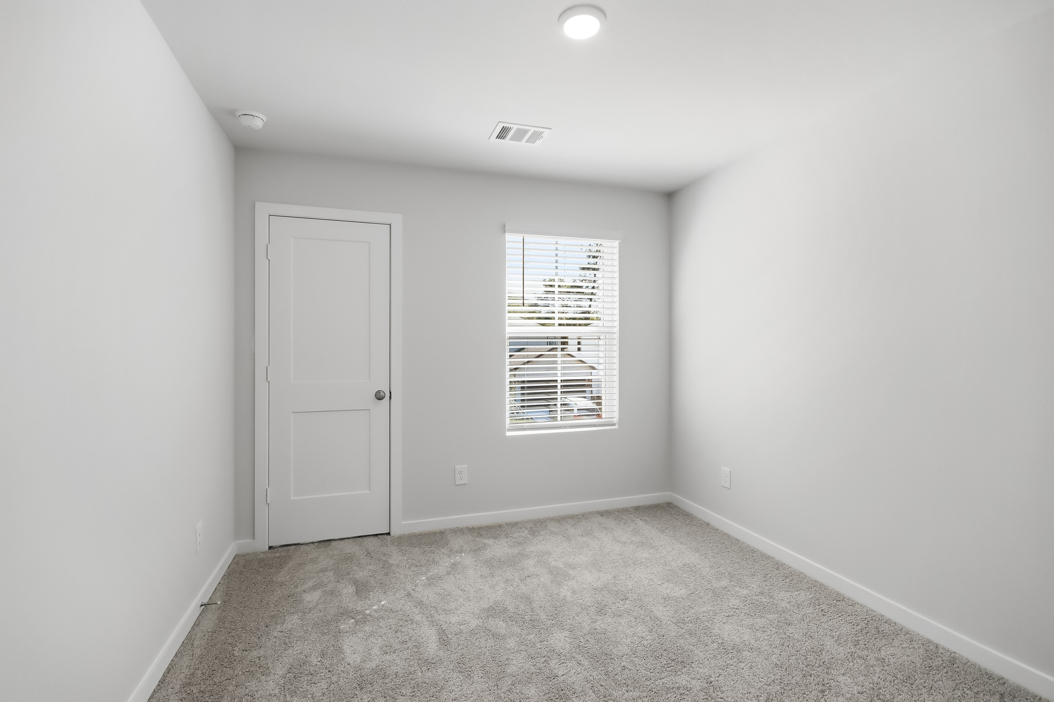 A room with a door and a window.