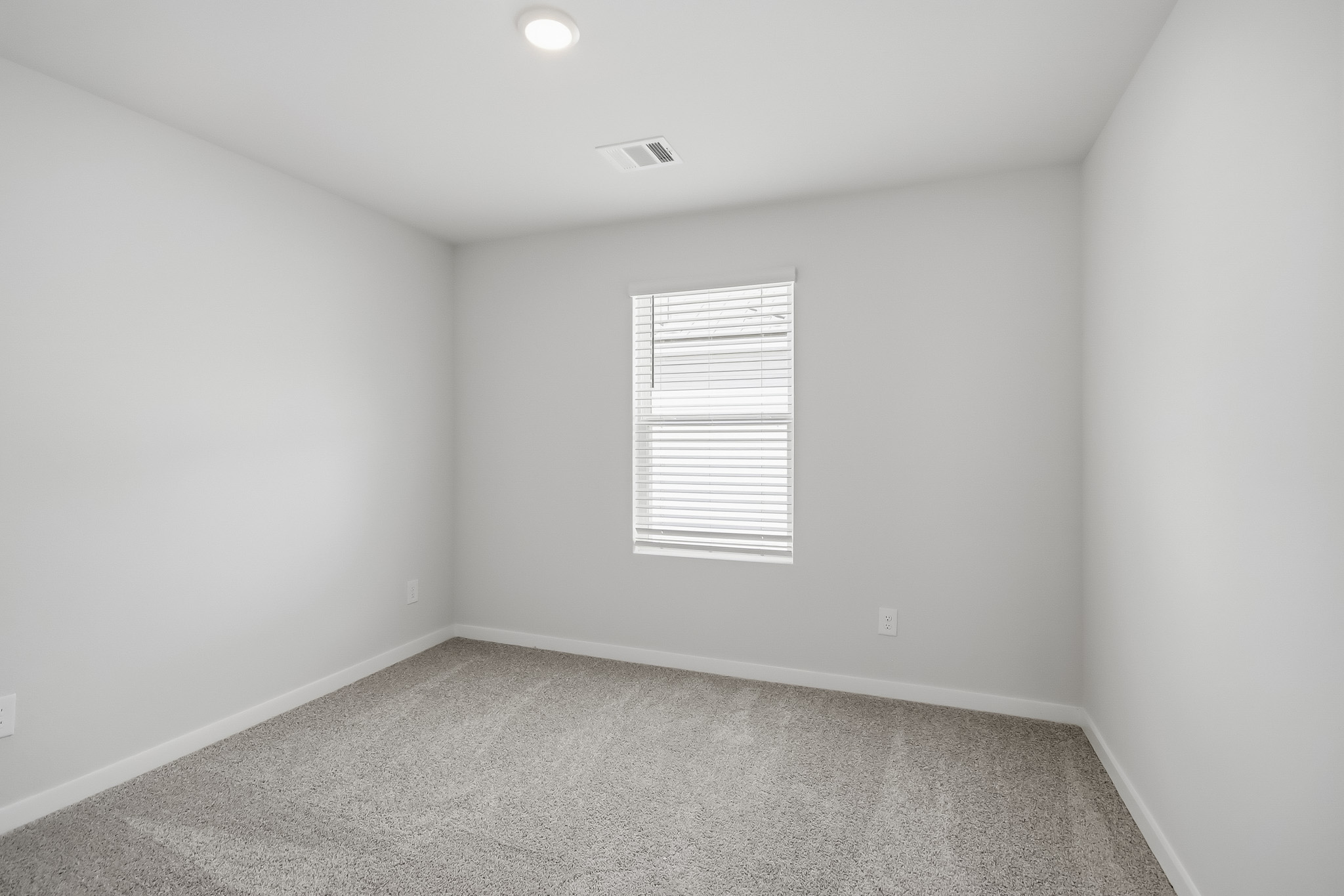 A room with a door and a window.