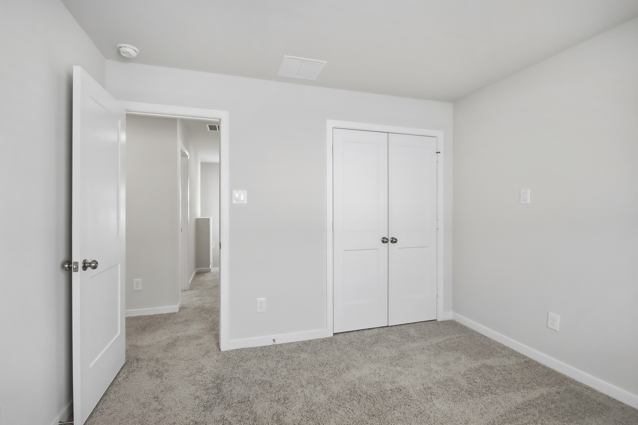 A room with white doors.