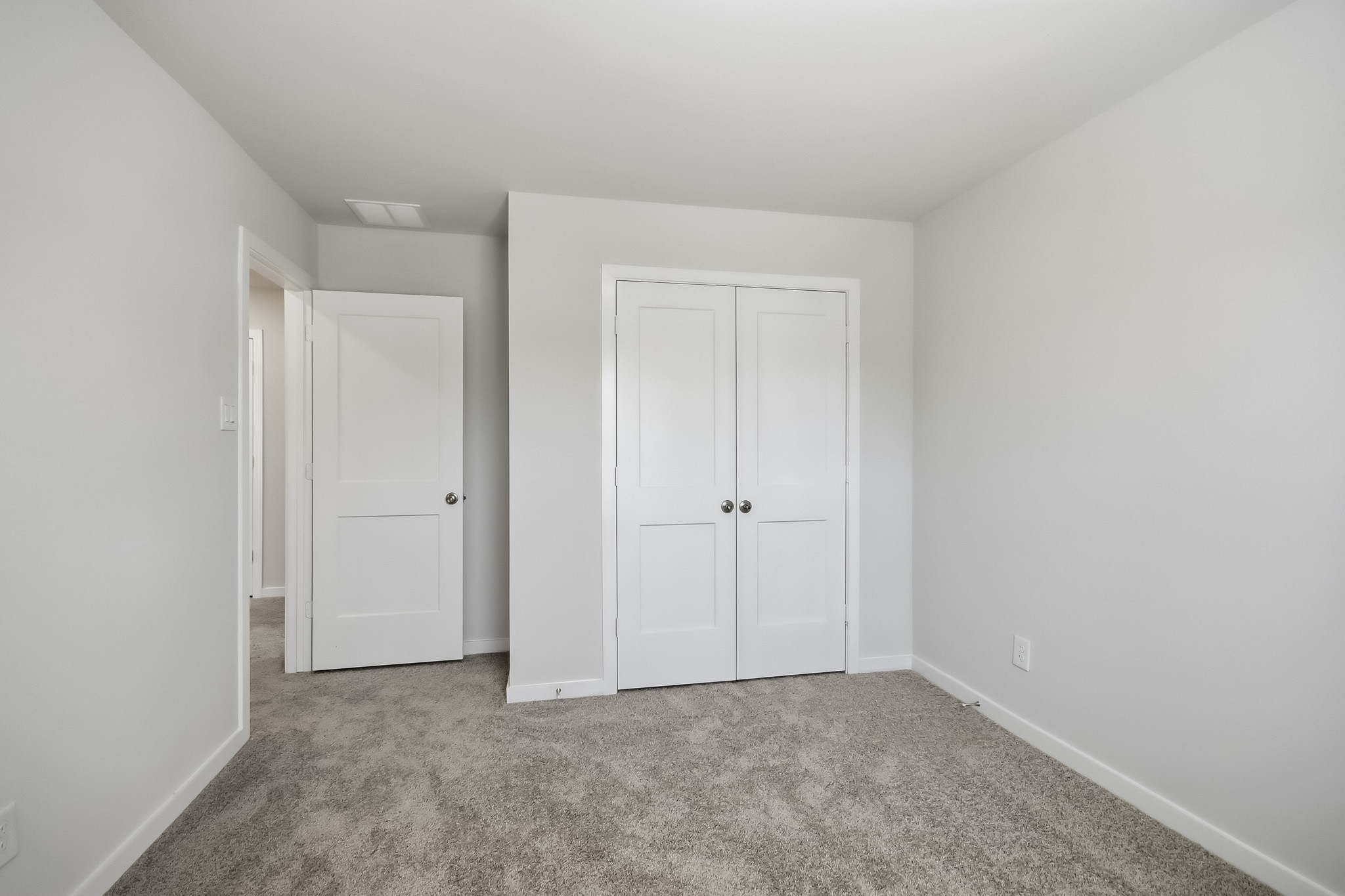 A room with white doors.