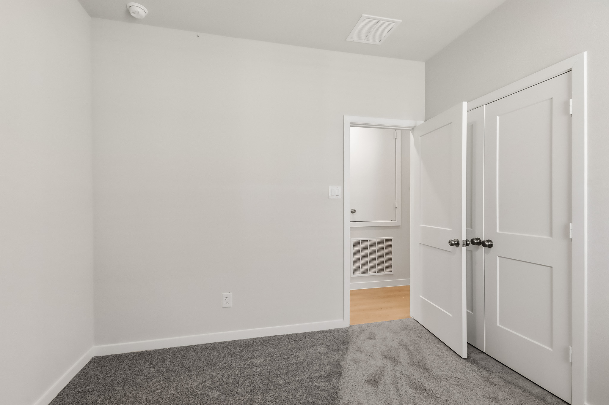A room with white doors.
