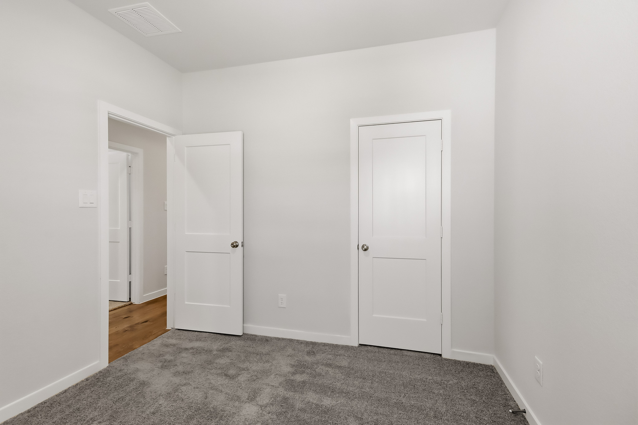 A room with white doors.