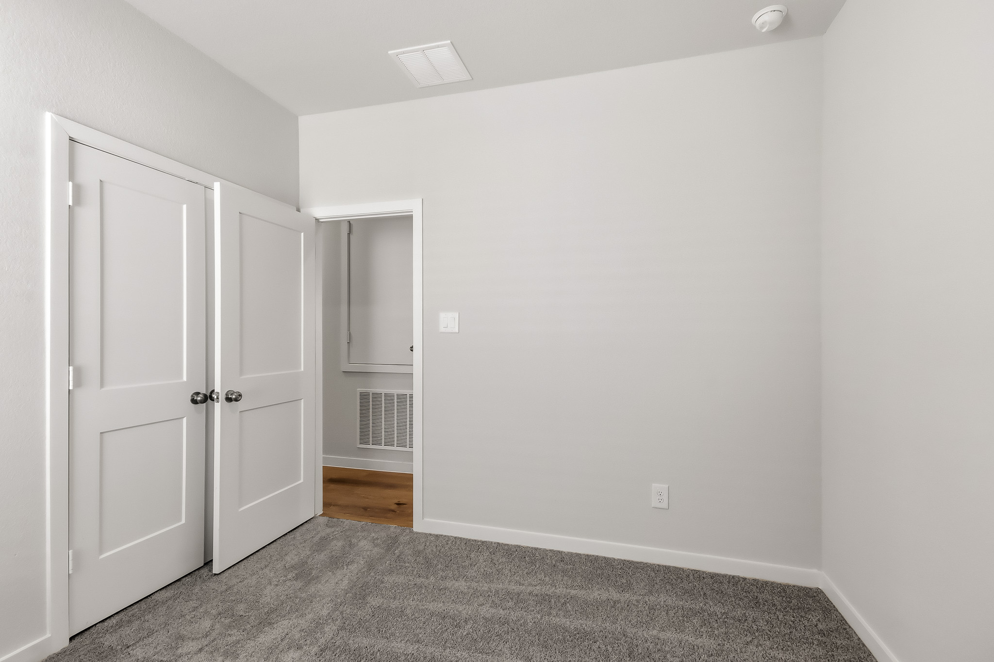 A room with white doors.