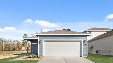 A building with garages and a driveway.