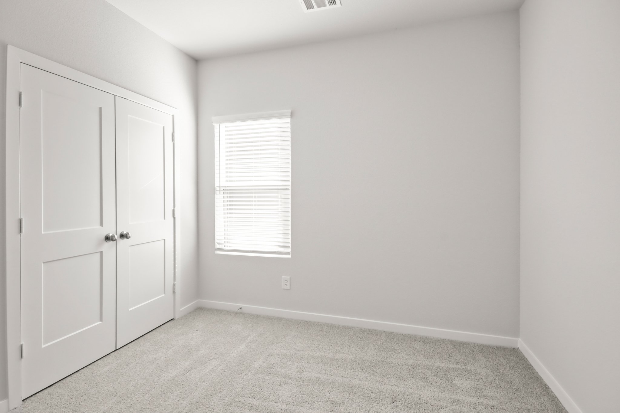 A room with white doors.