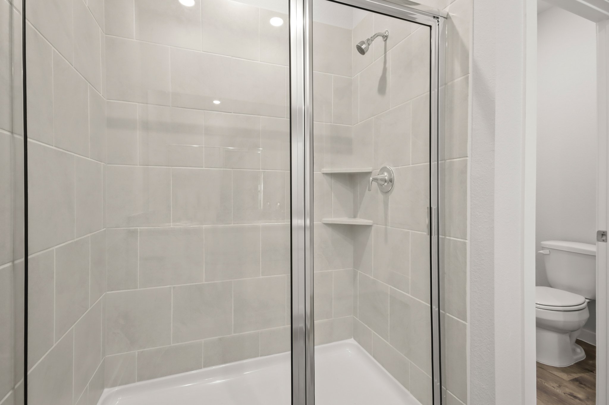 A bathroom with a glass shower.