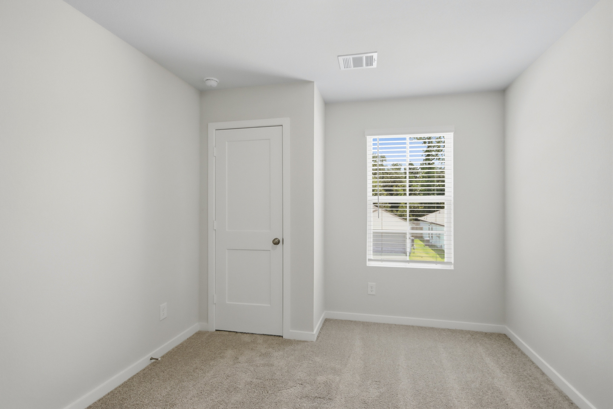 A room with a door and a window.