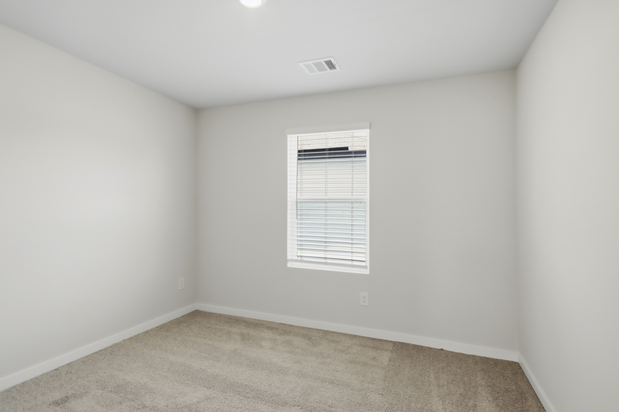 A room with a door and a window.