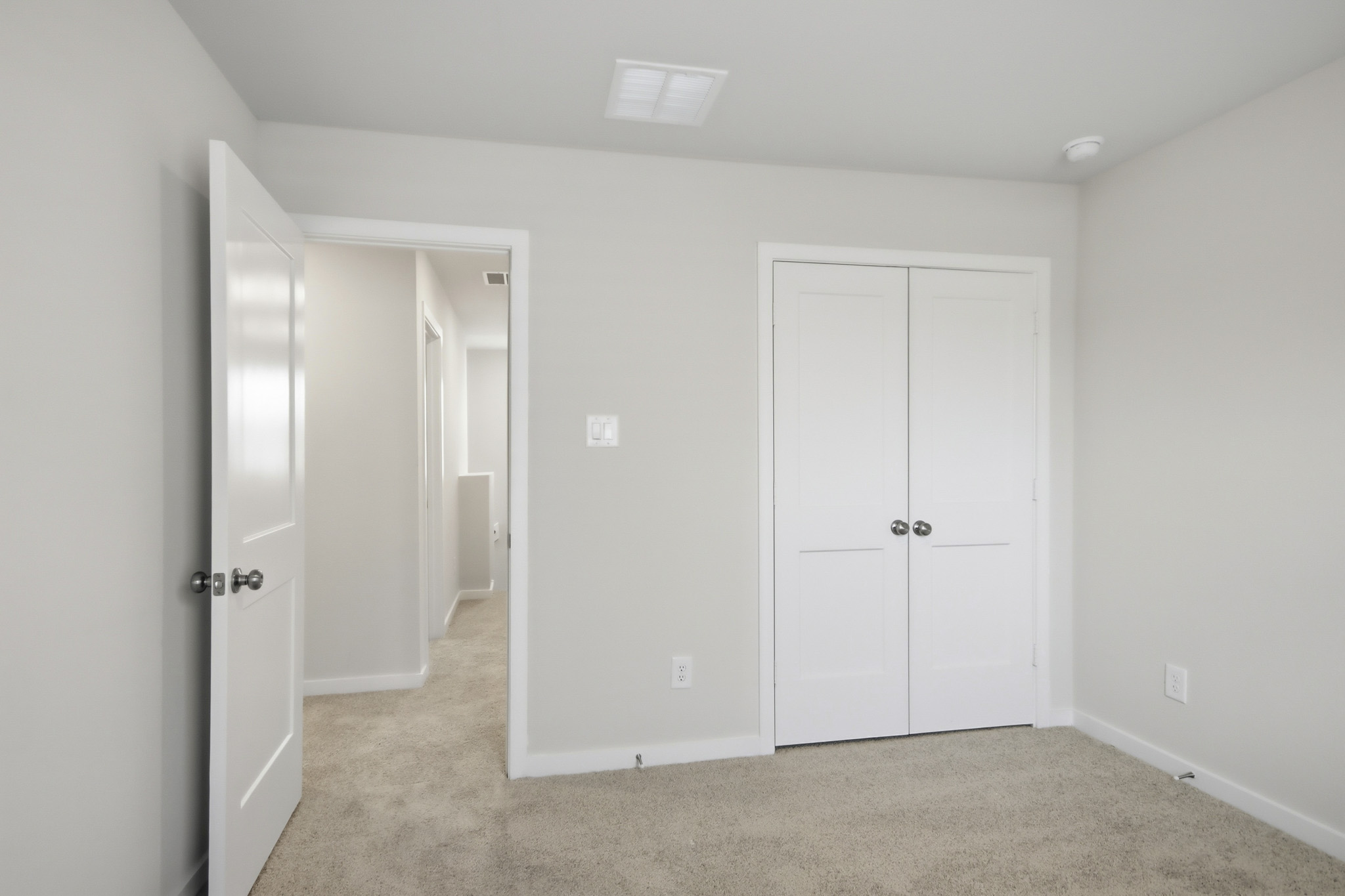 A room with white doors.