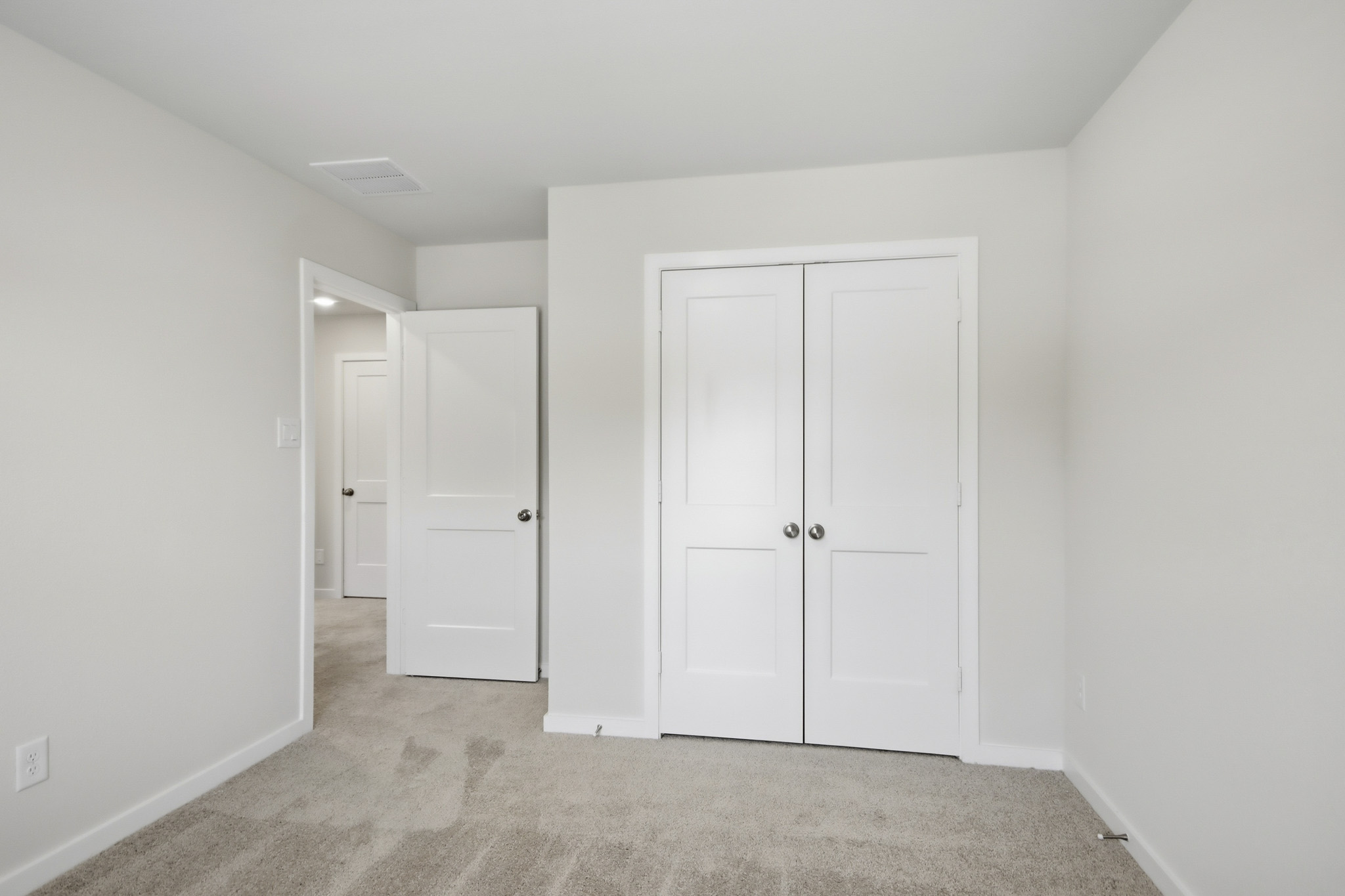 A room with white doors.