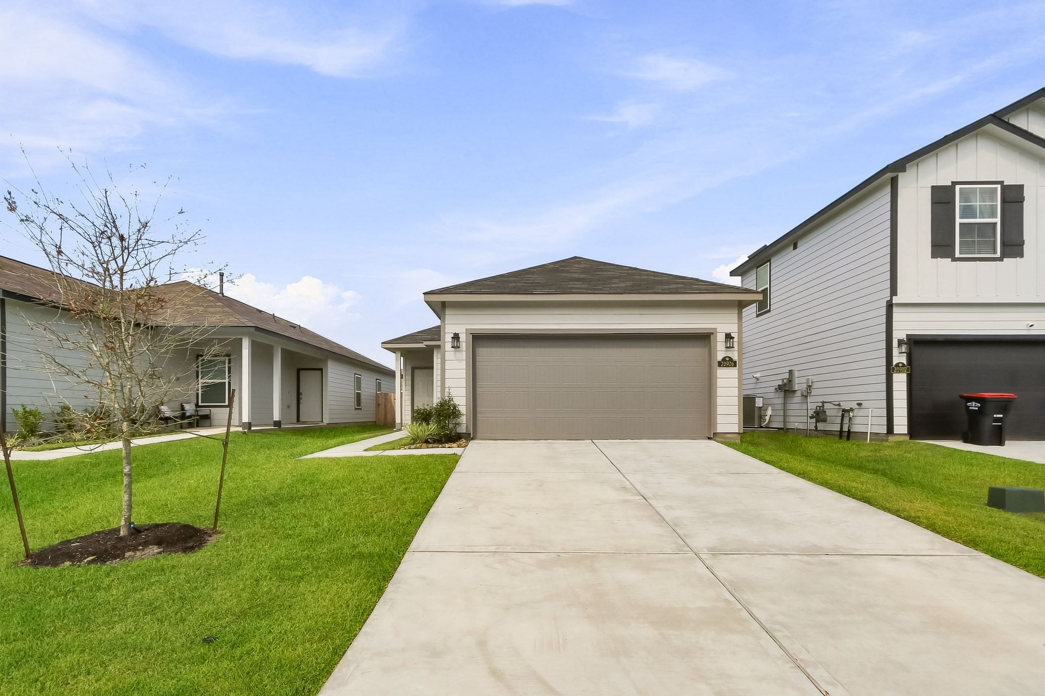 A driveway leading to a house.