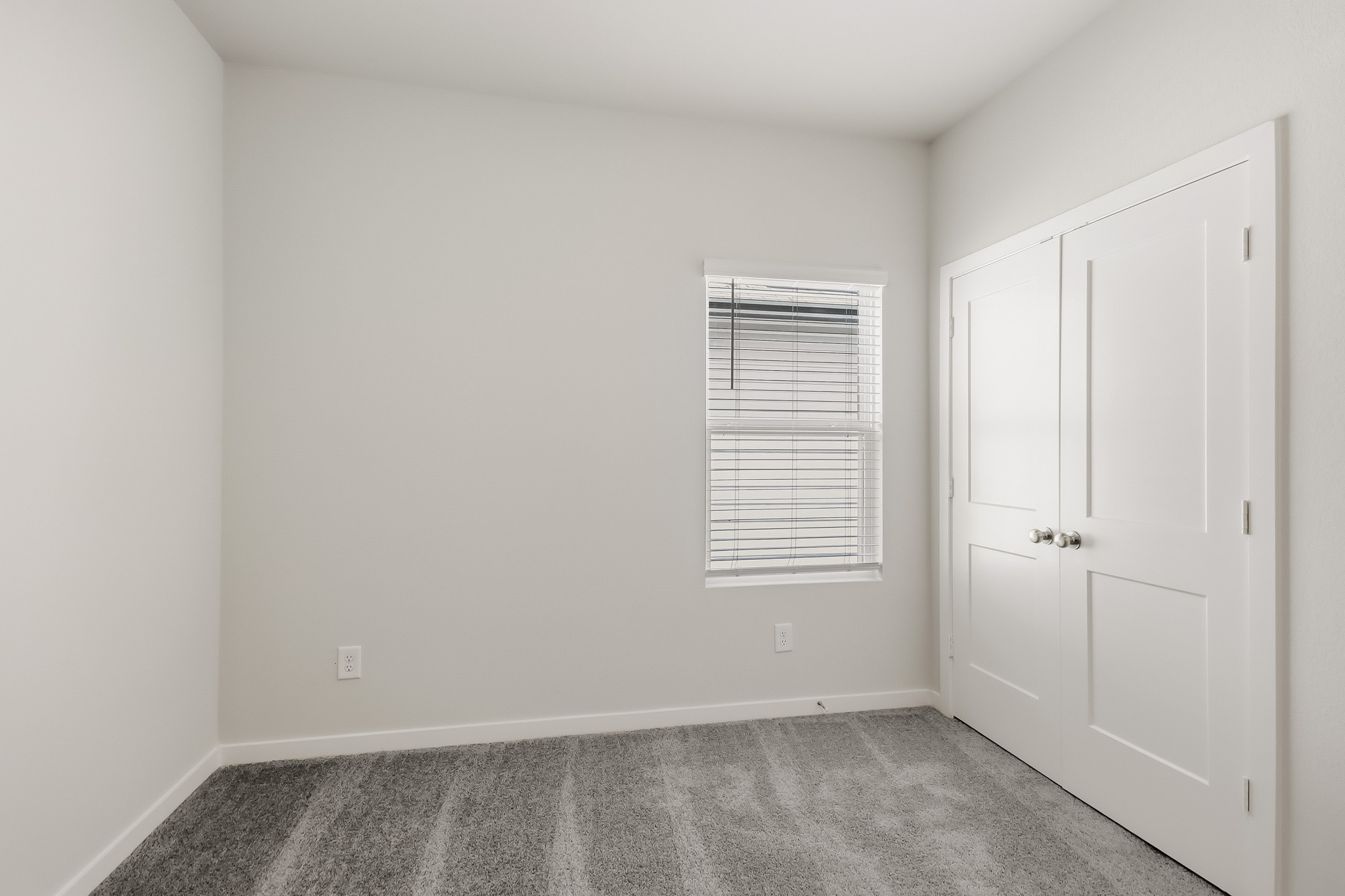 A room with white doors.
