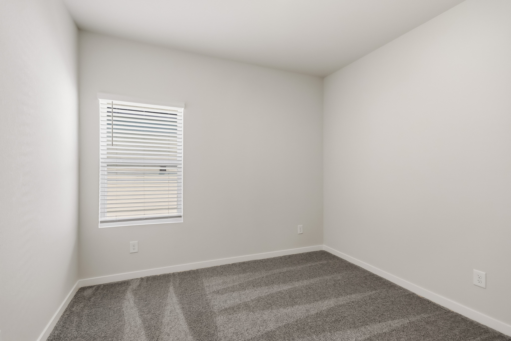 A room with a door and a window.
