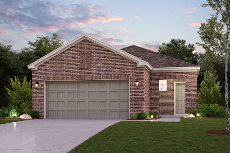 A brick house with a garage.