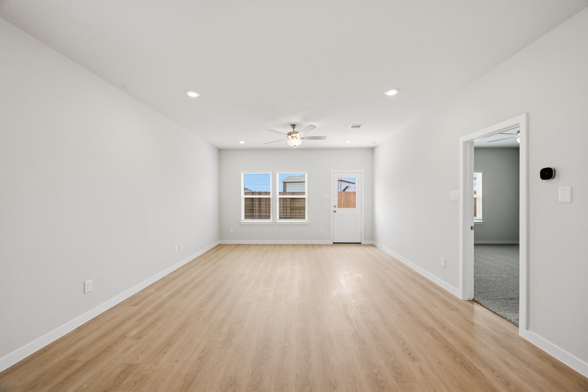 A room with a wood floor and a wood floor.
