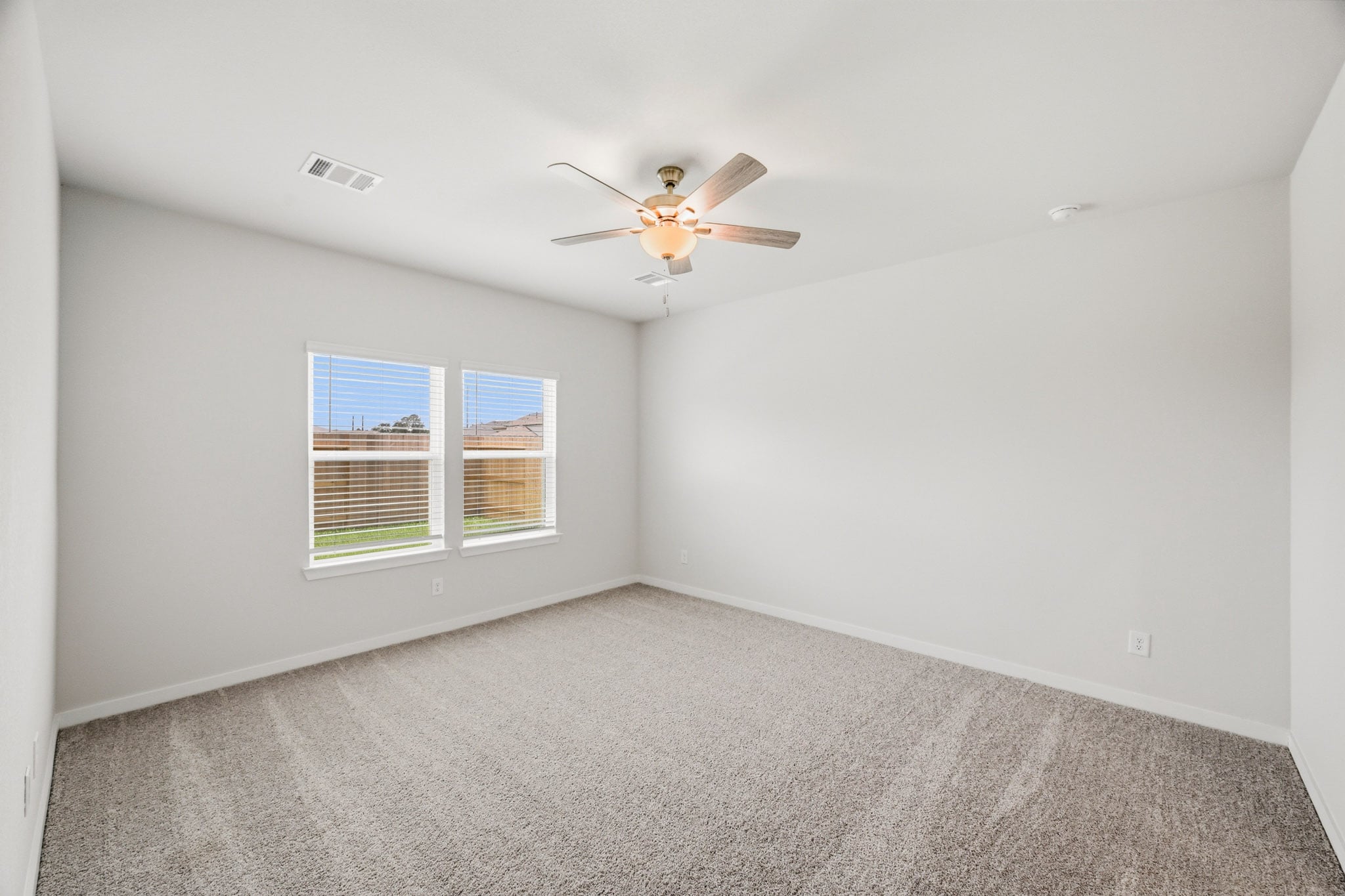 A ceiling fan in a room.