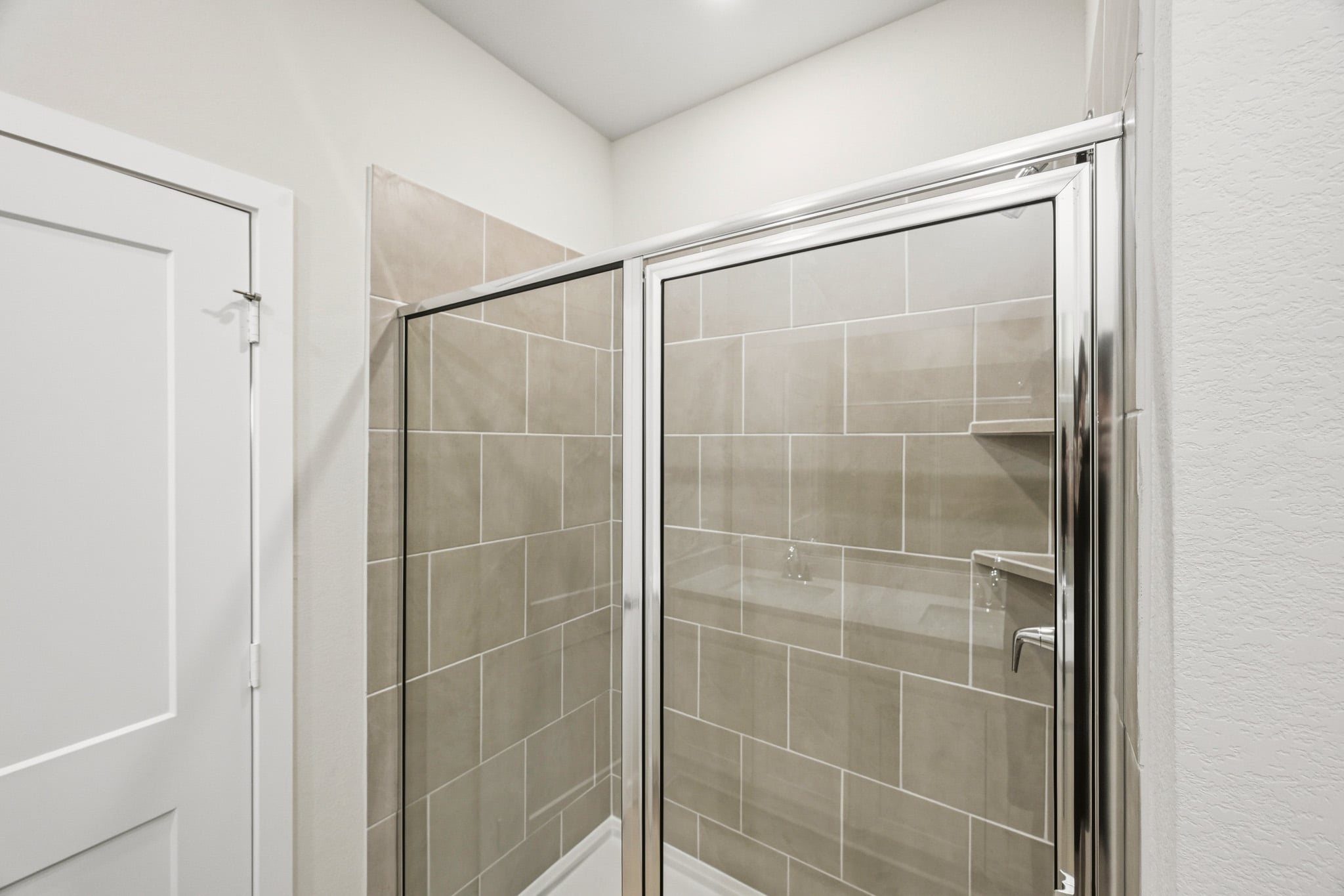 A shower unit in a bathroom.