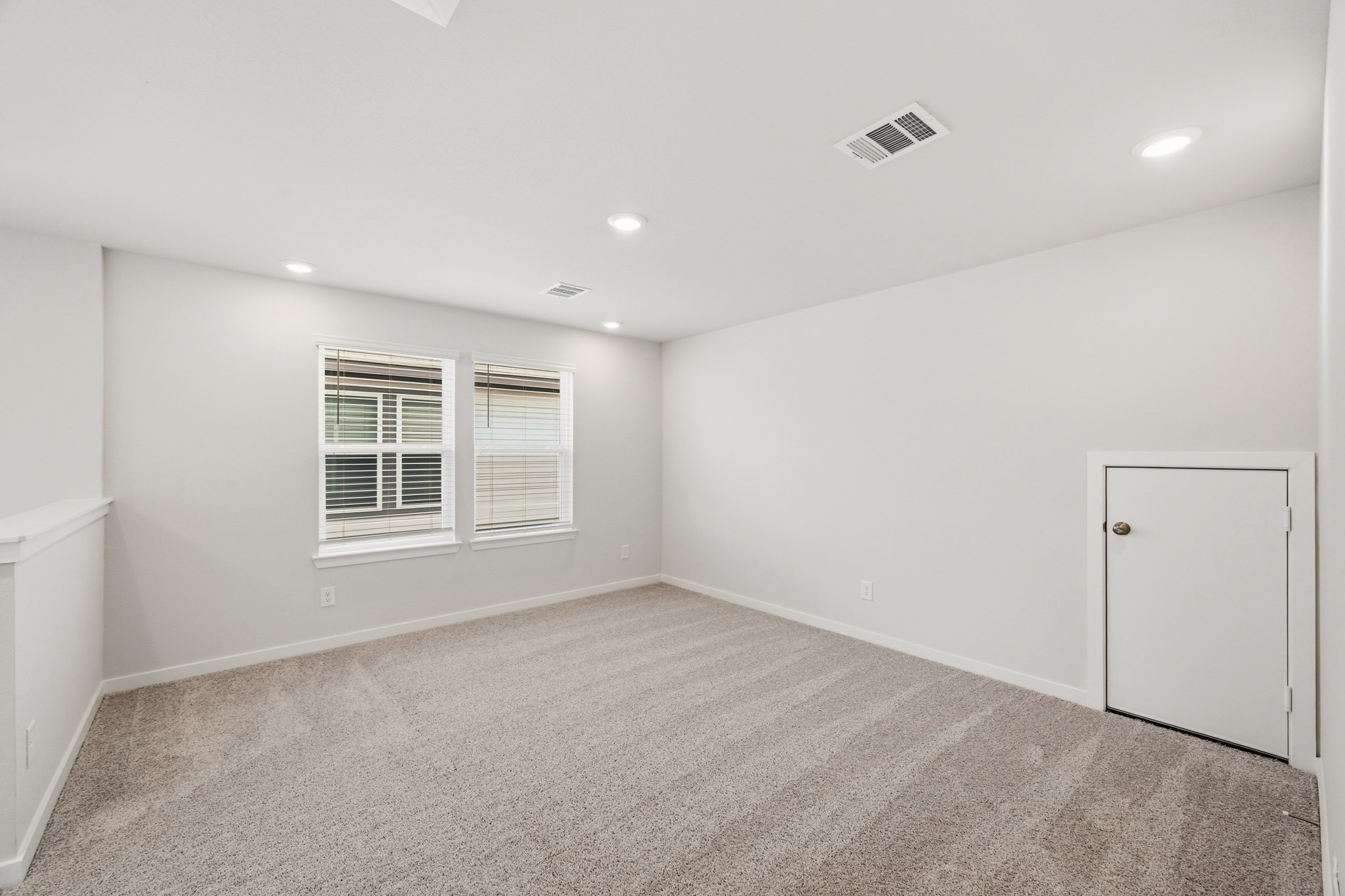 A room with a door and a window.