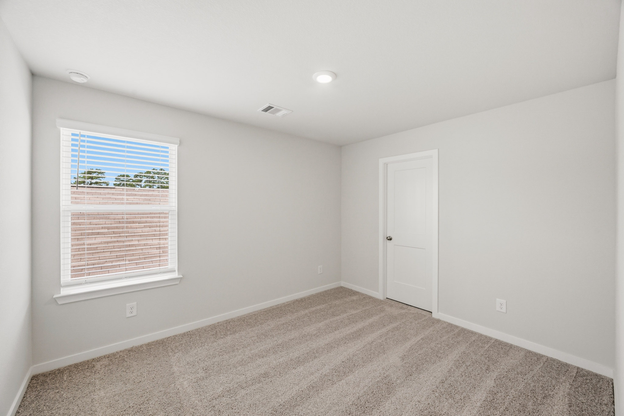 A room with a window and a door.