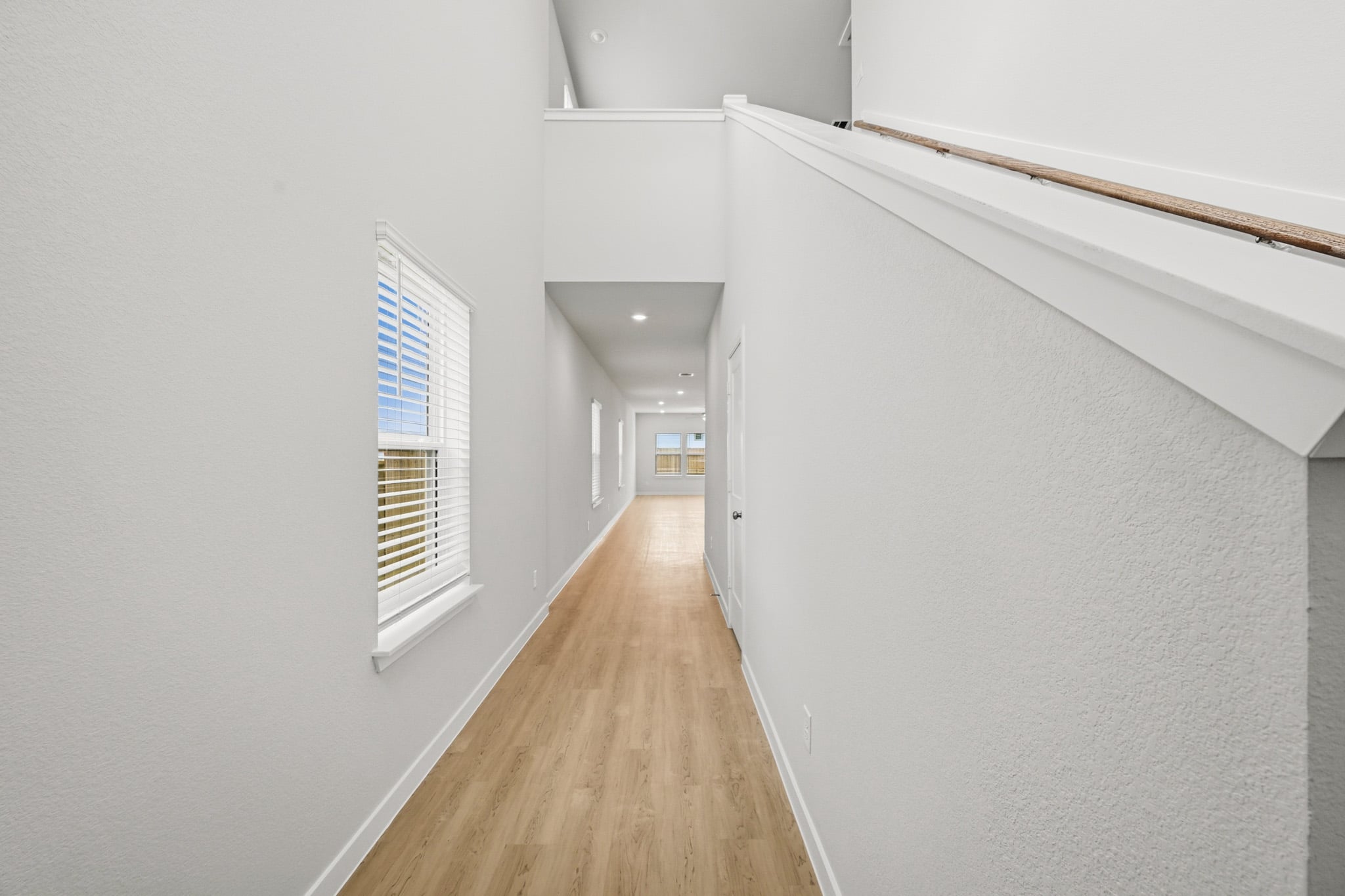 A hallway with white walls.